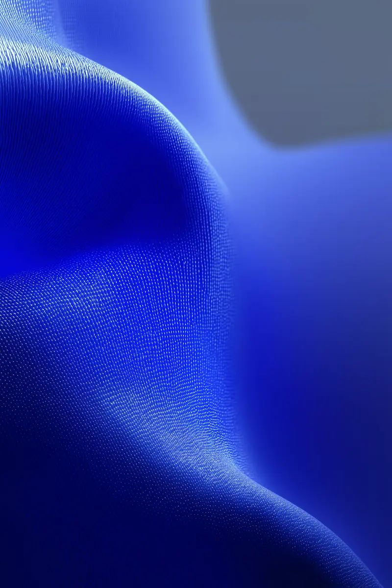 Close-up of a sleek black electronic device with a glossy surface and circular buttons in a row.