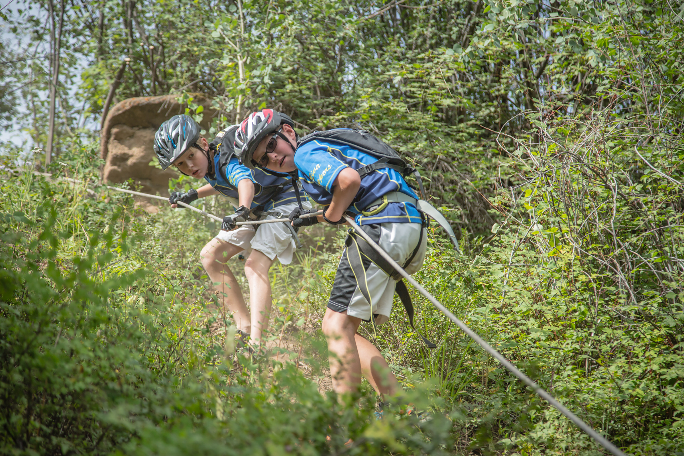 Kids competing on alpine singletrack at Snow Summit Big Bear during The Kids Adventure Race 2026