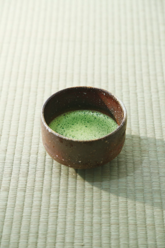 Ceremonial matcha in a bowl on a tatami mat