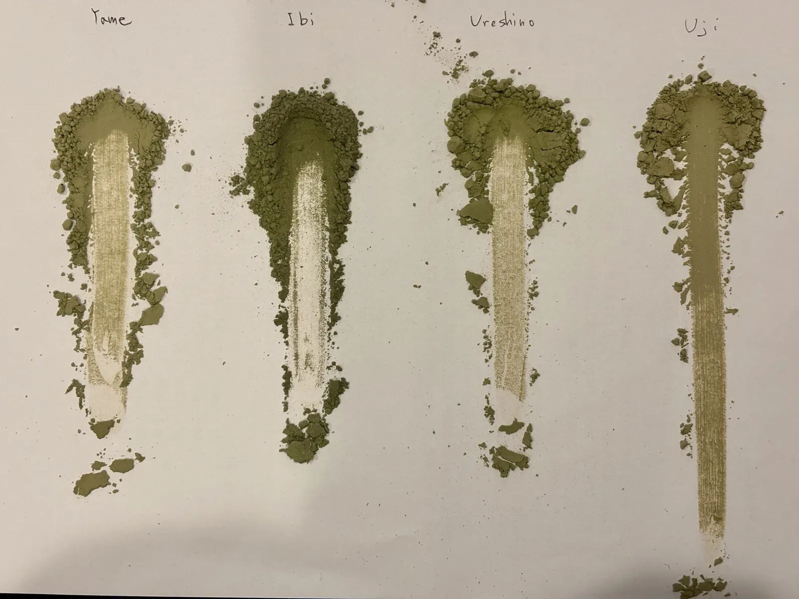 Matcha from Yame, Ibi, Ureshino, and Uji smeared on paper to compare colour.
