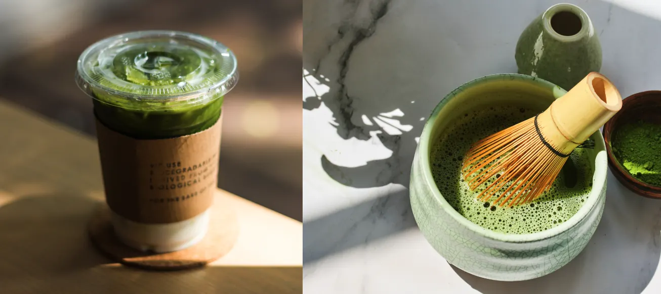 Iced matcha latte in a takeaway cup beside a bowl of freshly whisked matcha with a bamboo whisk and scoop.