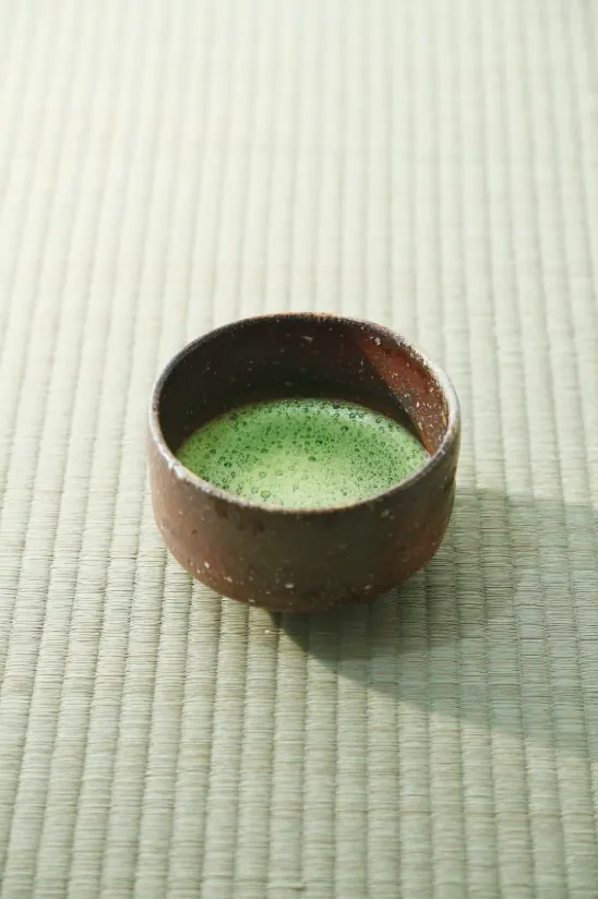 Ceremonial matcha in a bowl on a tatami mat