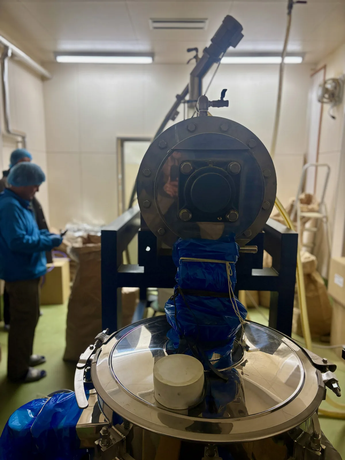 A matcha mill inside a processing room at a partner wholesaler in Kirishima.