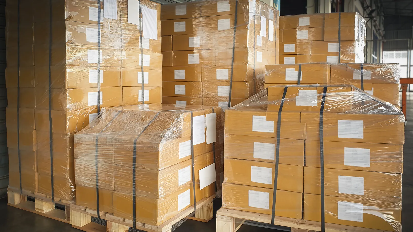 Stacked pallets of boxes in a storage warehouse