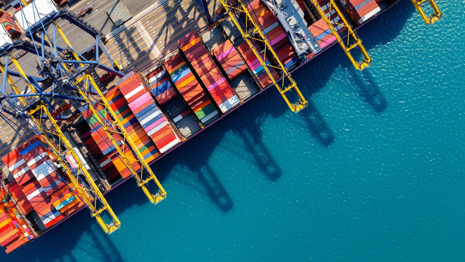 Containers stacked at a shipping terminal seen from above