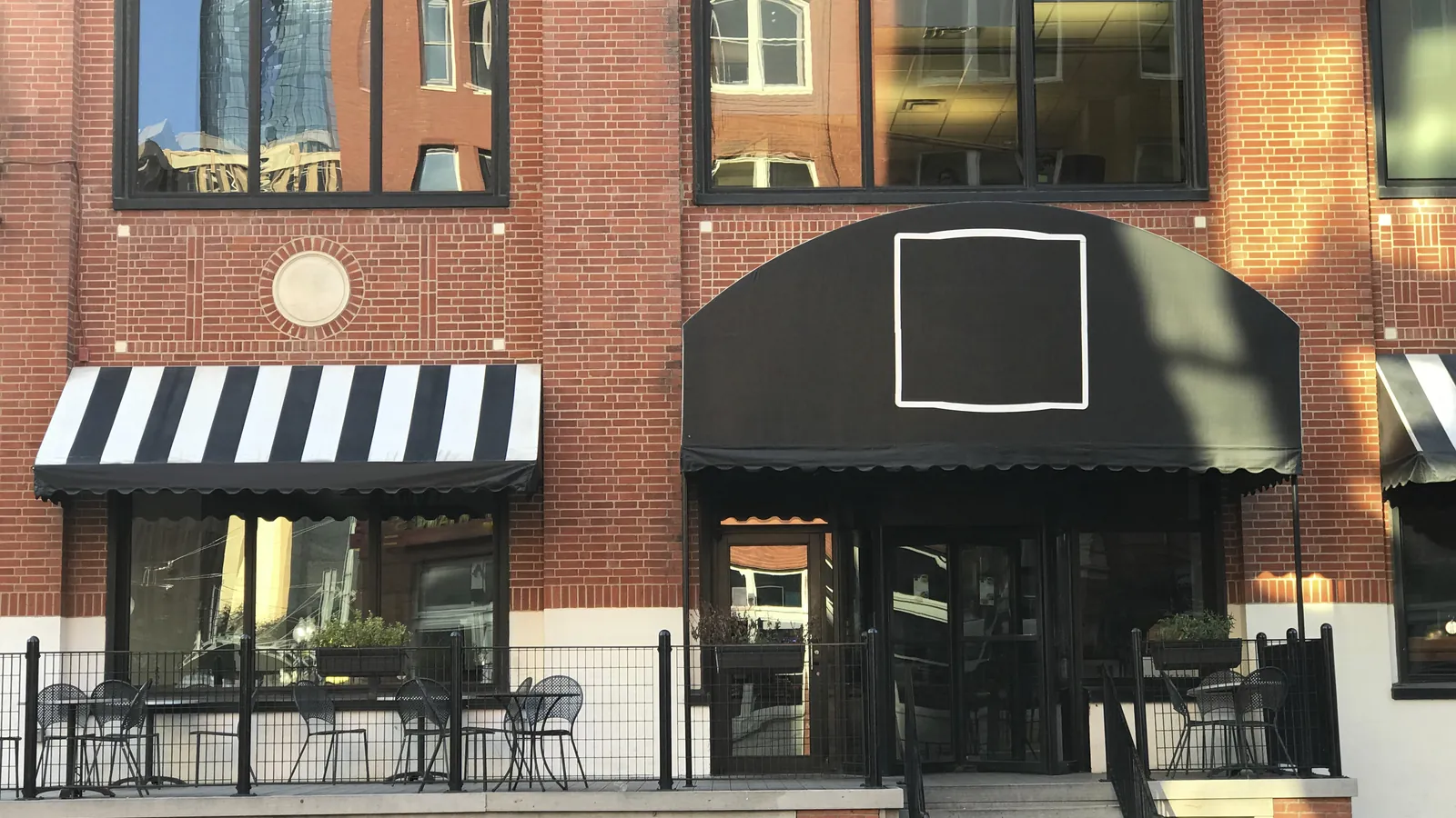The exterior of an independent cafe on a city street