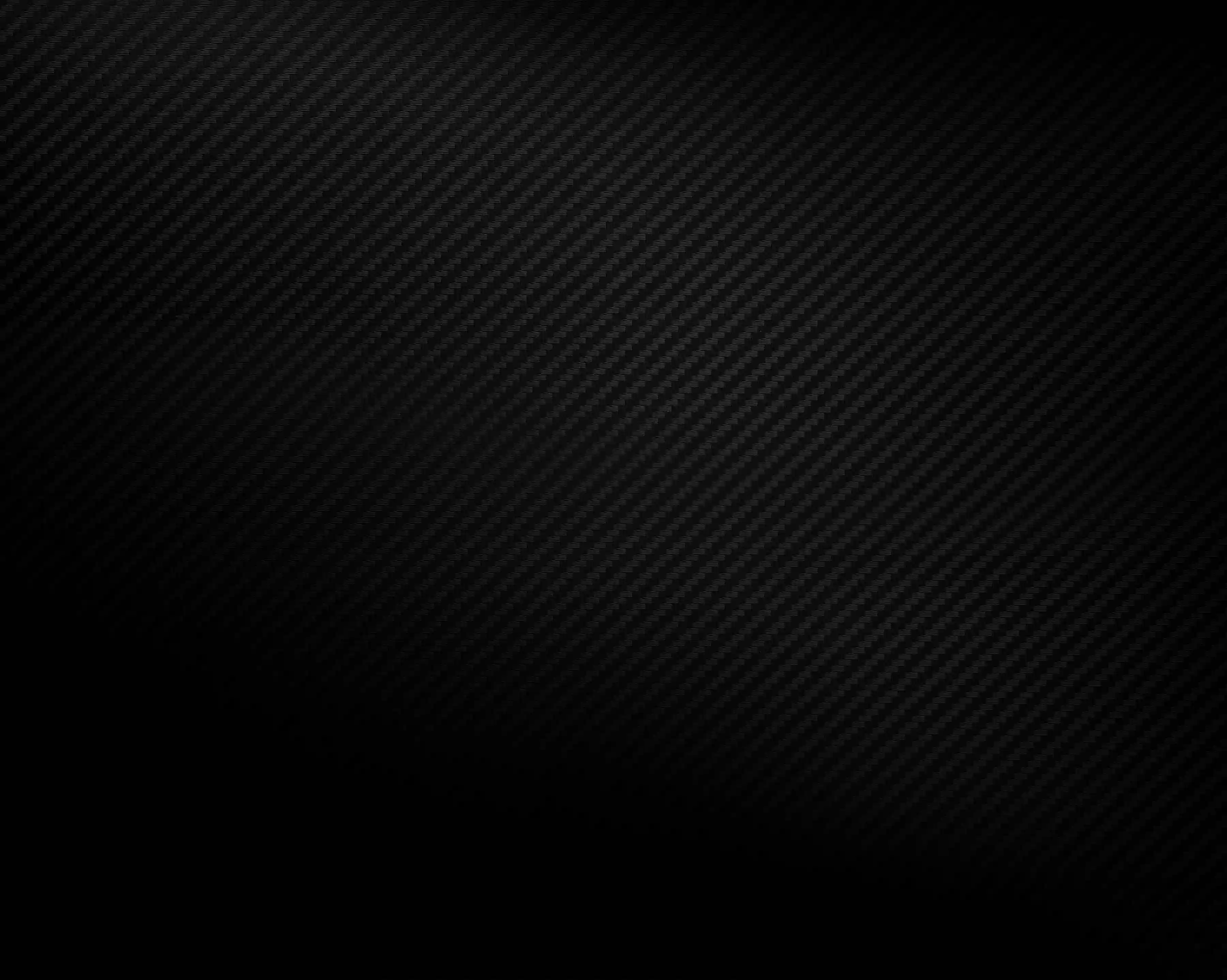 Black carbon fiber texture with a subtle diagonal weave pattern and gradient shading.