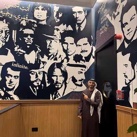 MFM Media exhibition booth with cinematic black and white film artwork display