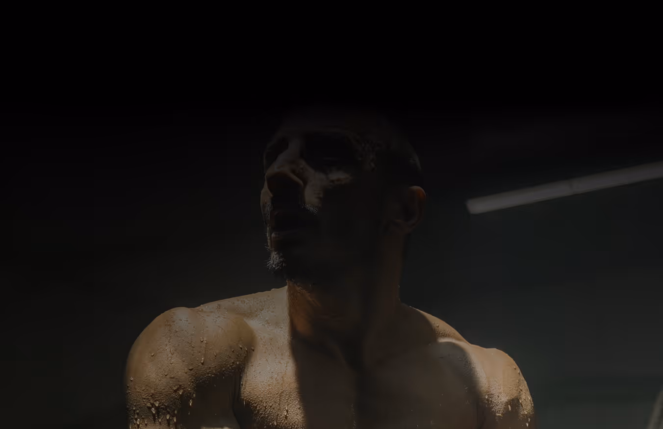 Actor in a dramatic low-light cinematic scene during a film production