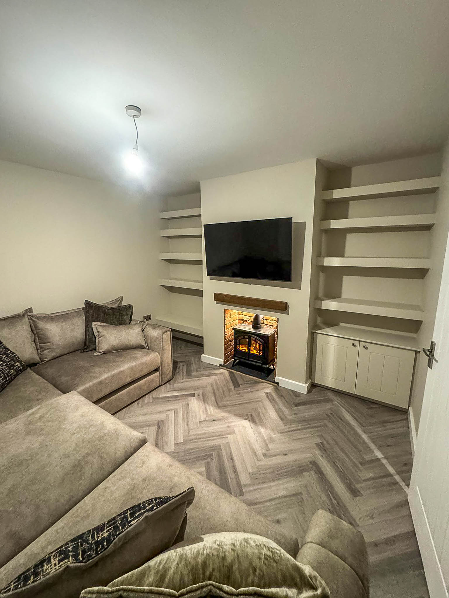Living room renovation with fitted units and fireplace in Cheshire home
