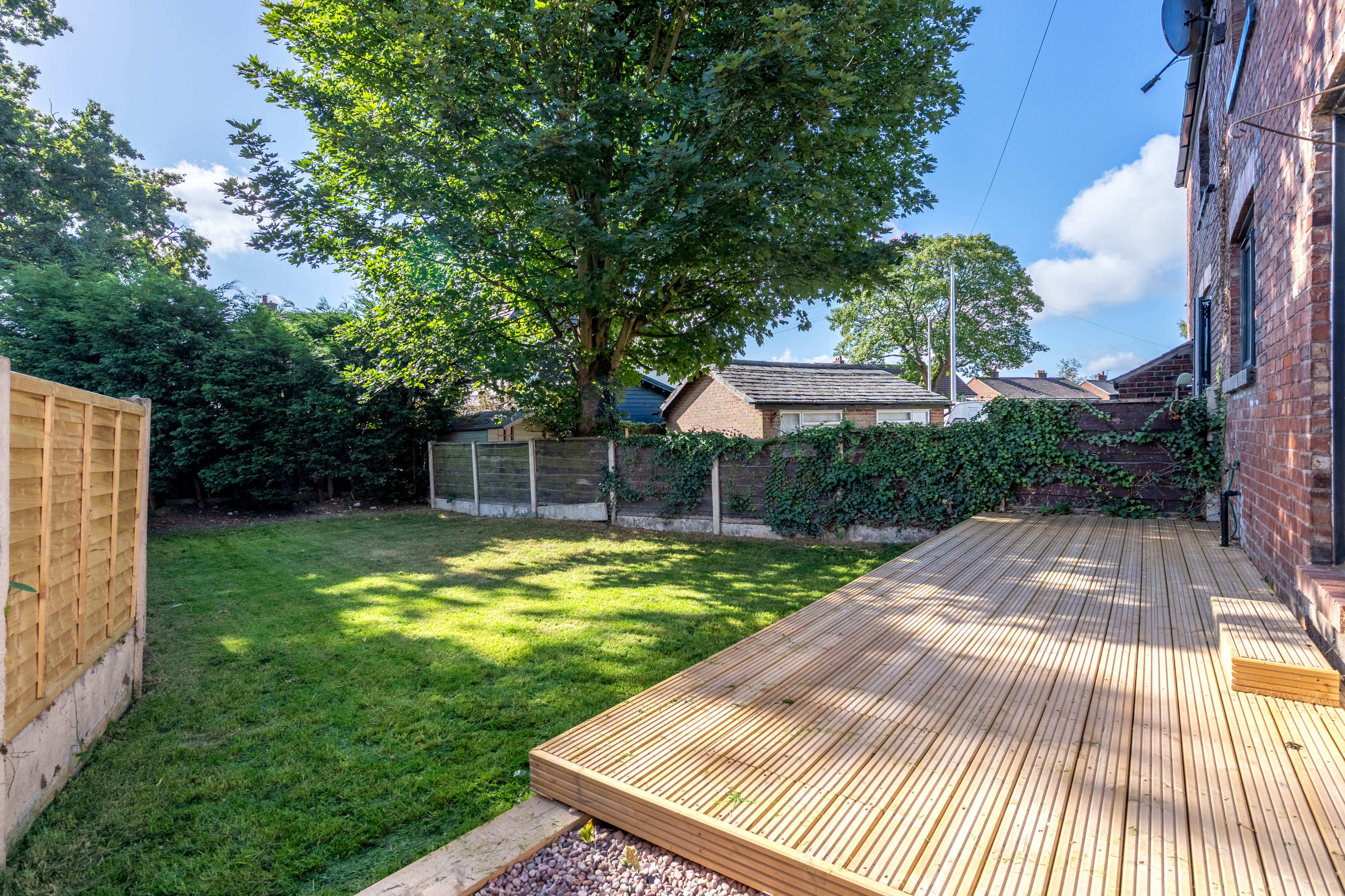 Rental property garden maintenance and new decking installation in Manchester