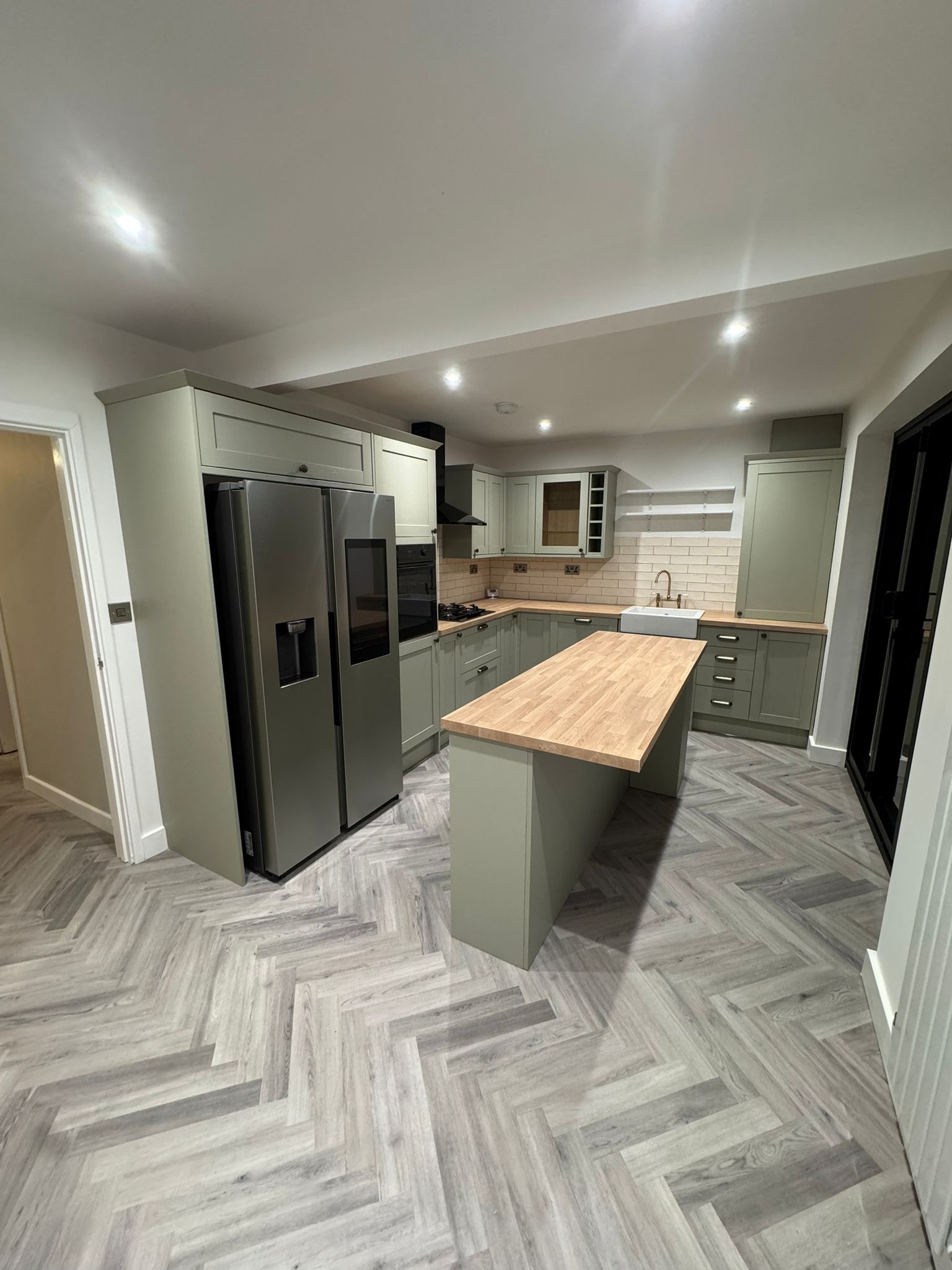 Modern kitchen refurbishment with island and fitted units in Glossop