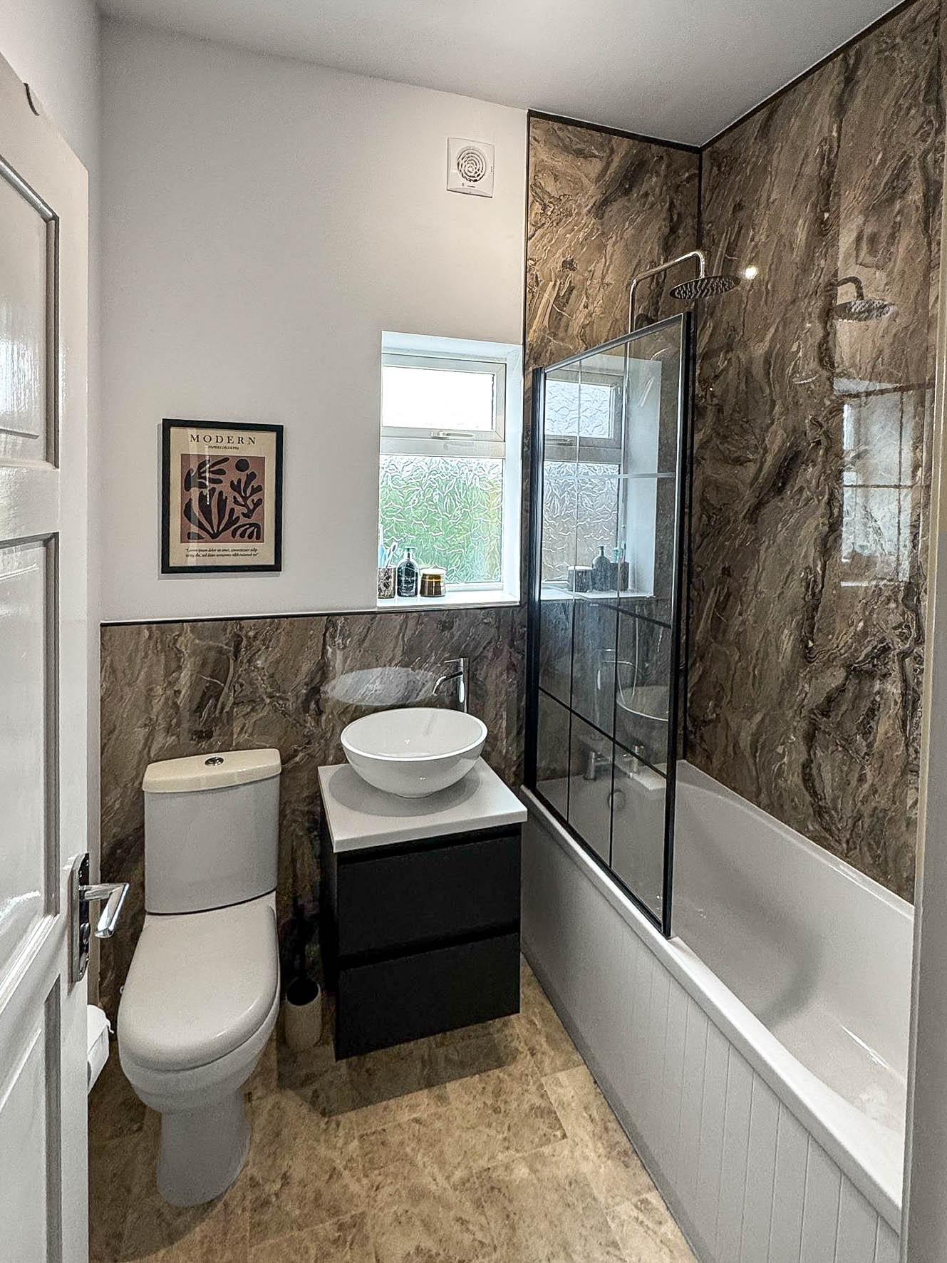 Compact bathroom refurbishment with shower and vanity unit in Derbyshire