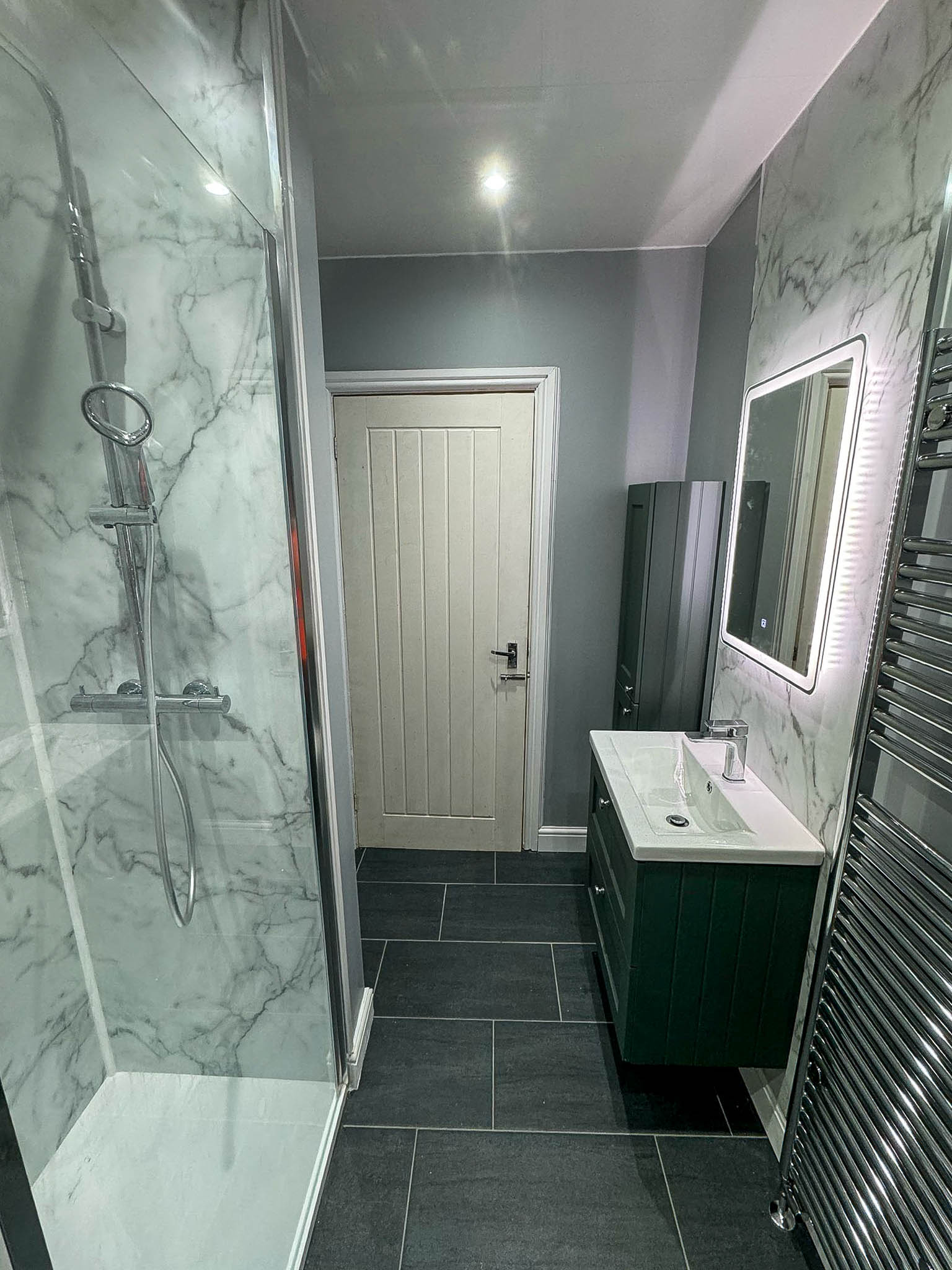 Bathroom installation with walk-in shower and modern fittings in Cheshire