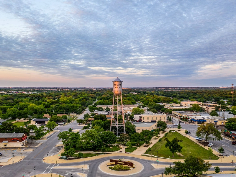Round Rock, TX suburban neighborhood with well-kept residential lawns.