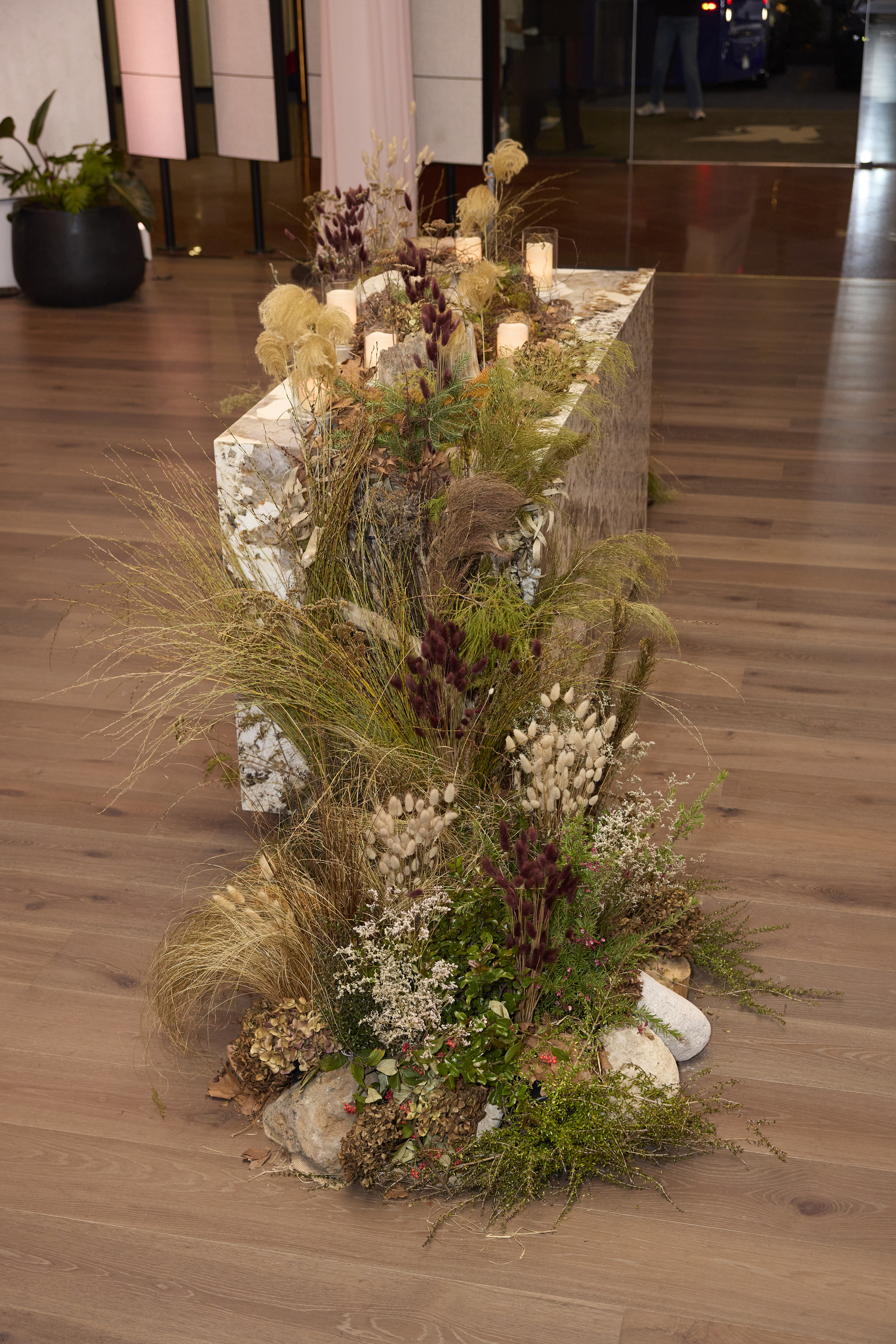 Dried grass and floral plinth by GreenAir at JW Marriott Auckland