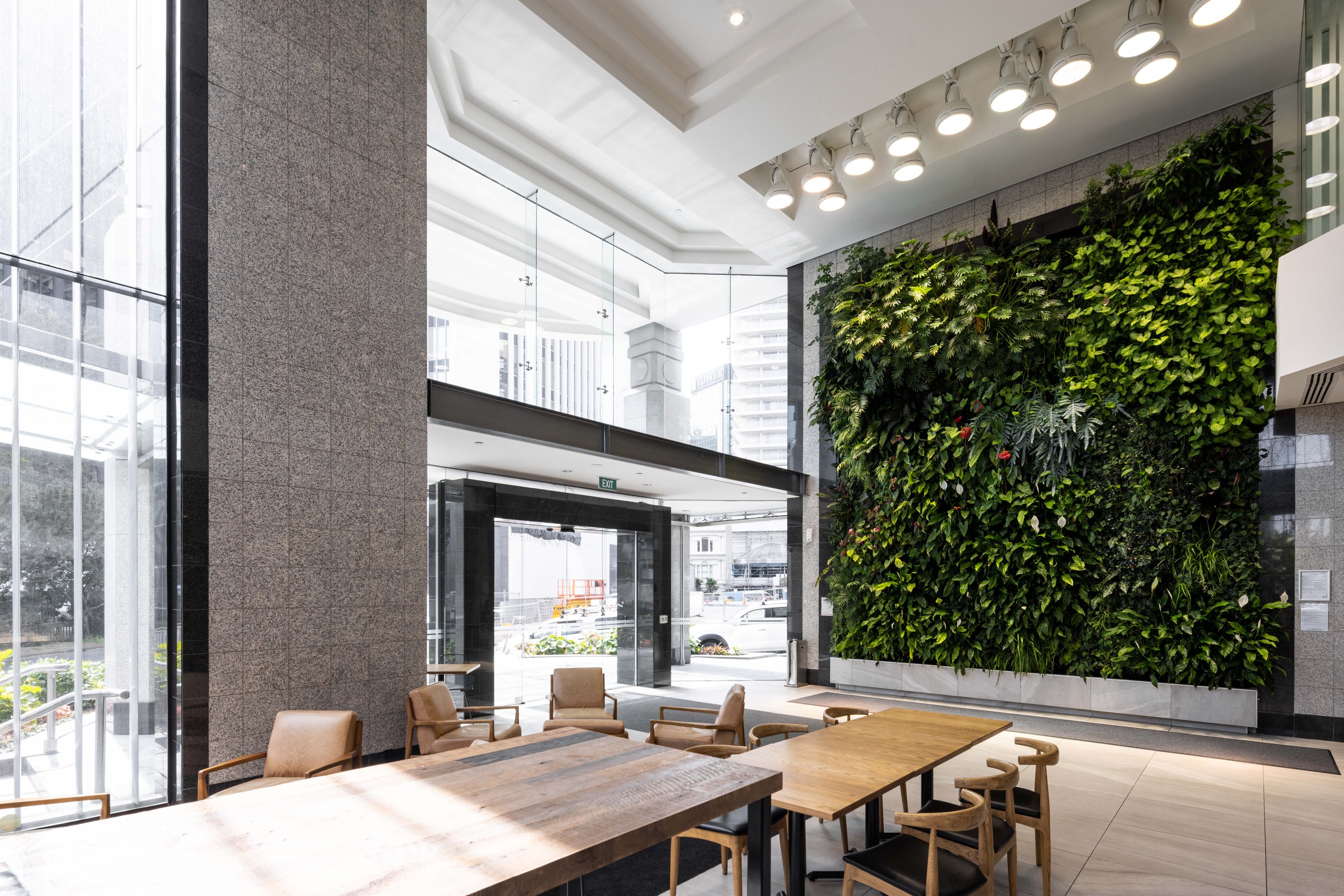 Interior living green wall beside a communal table at 22 Fanshawe Street by GreenAir