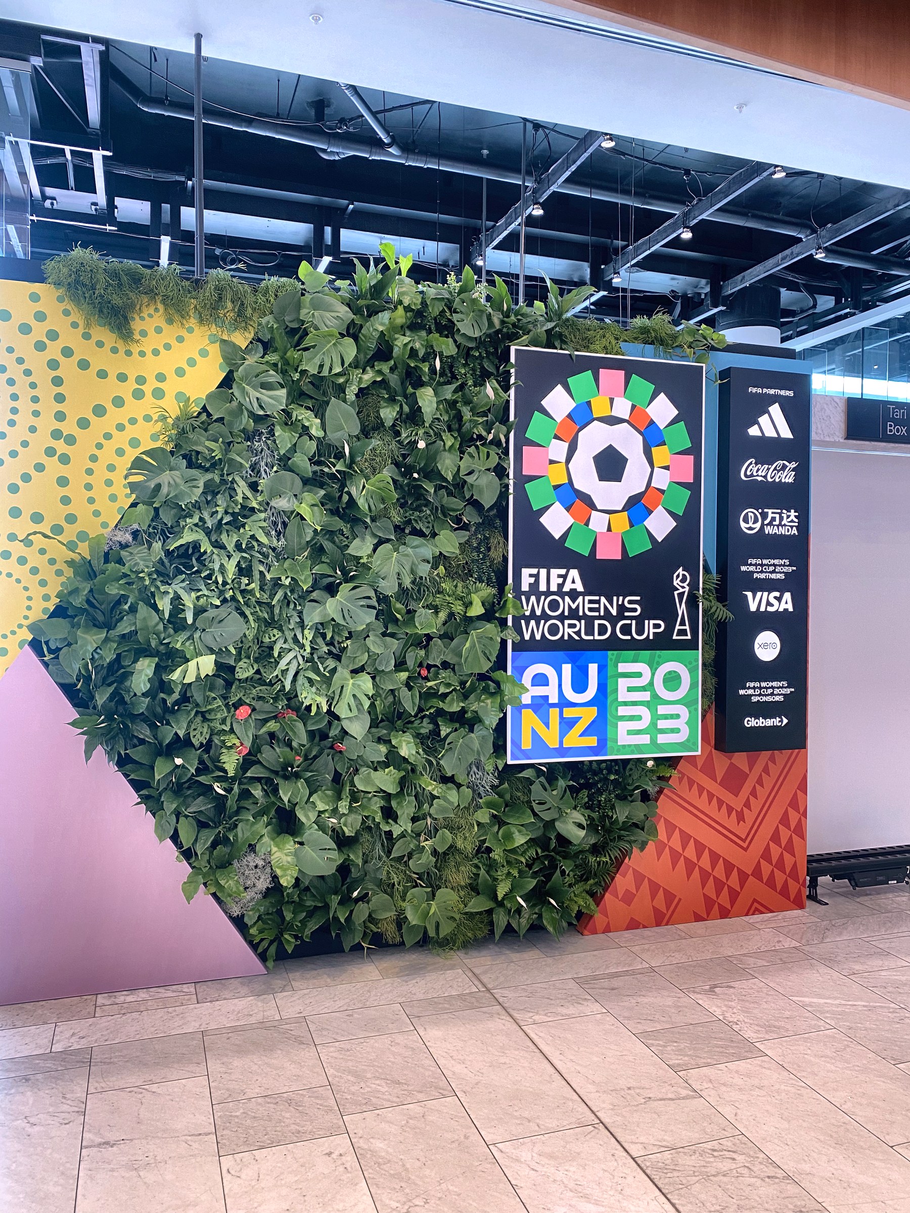Lush greenery framing FIFA Women's World Cup branding, GreenAir Auckland