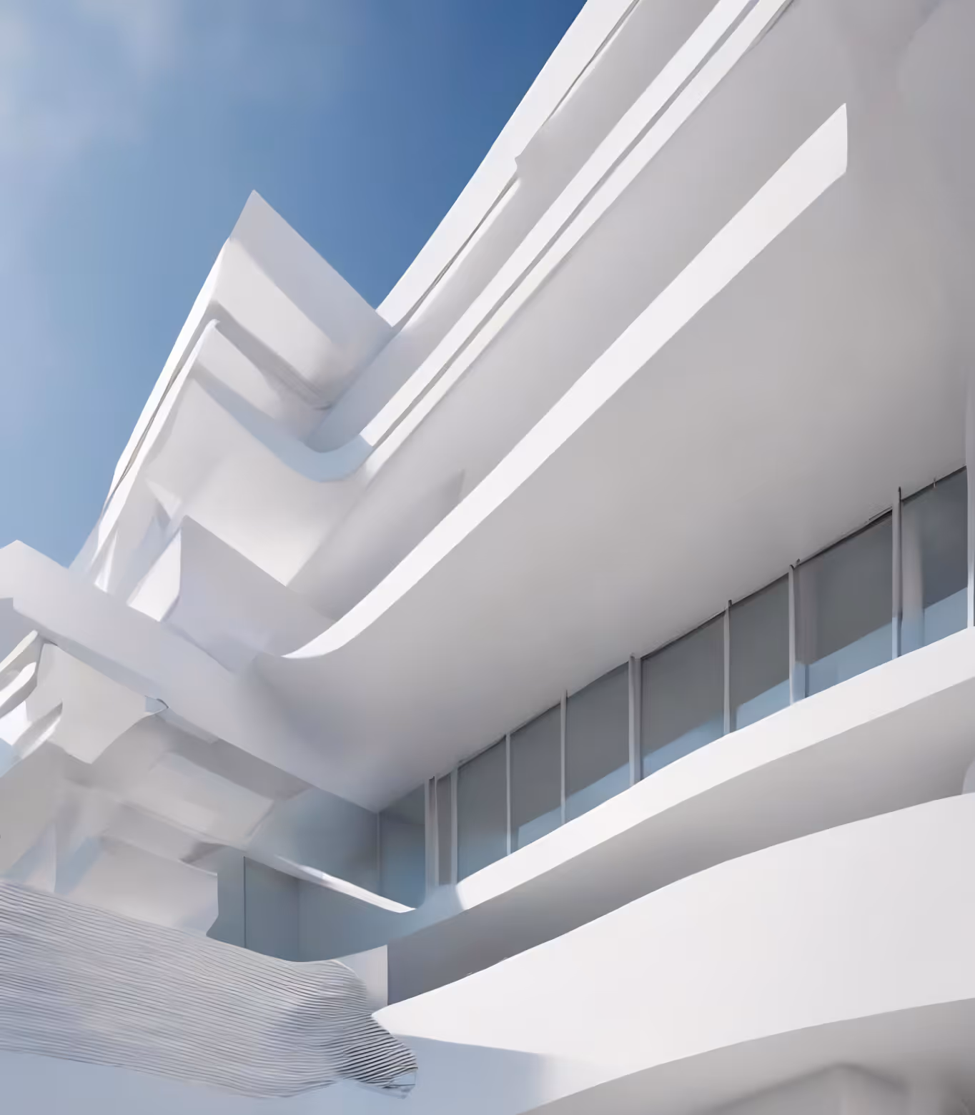Modern white building facade with curved balconies and large glass windows under a clear blue sky.