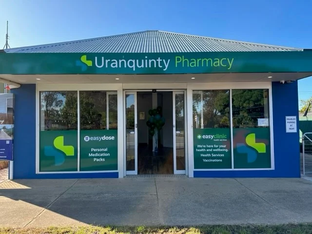 Uranquinty Pharmacy storefront with green signage and front entrance