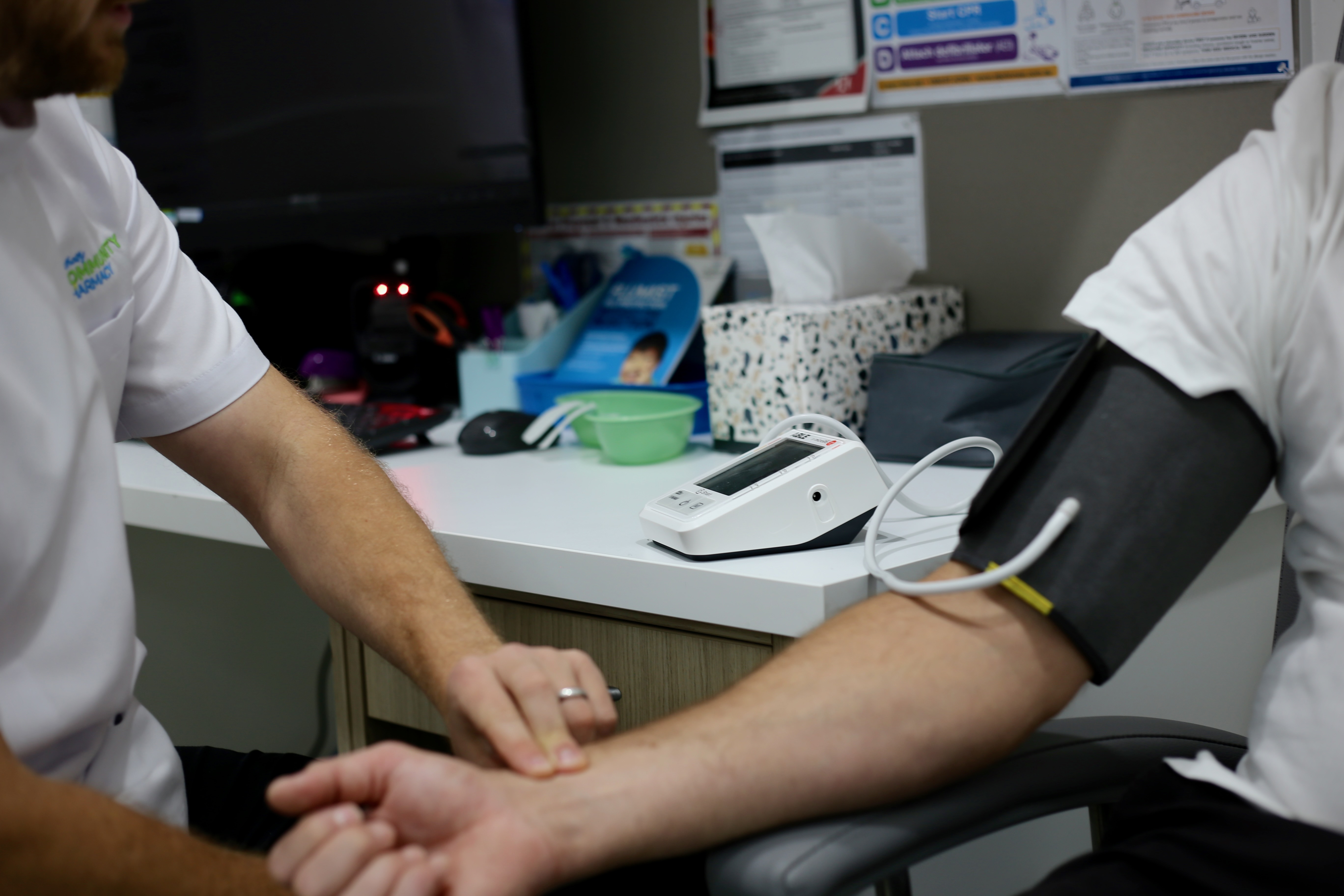 Blood pressure check during a pharmacy consultation