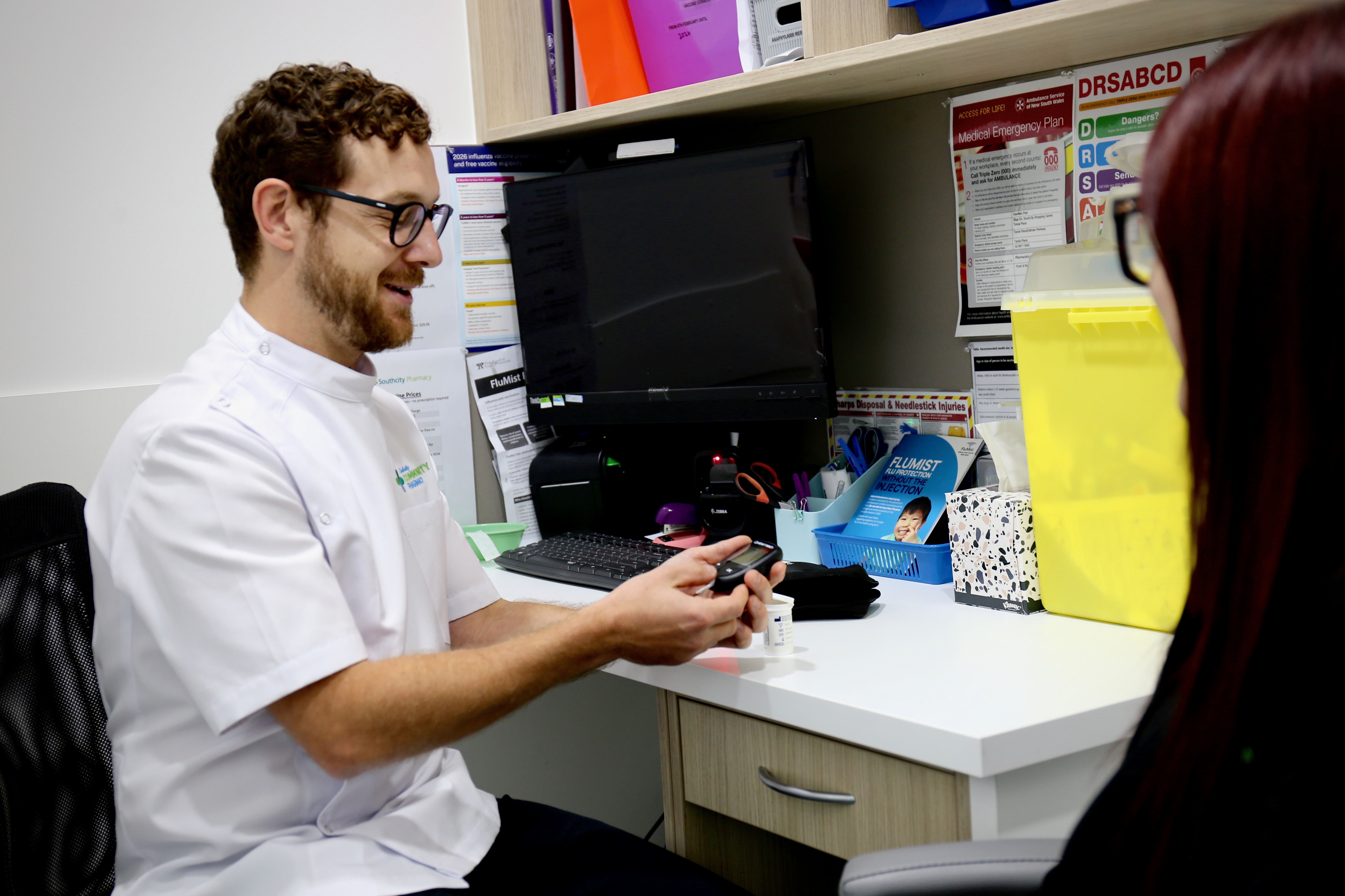 Pharmacist preparing a health check in a private consultation room