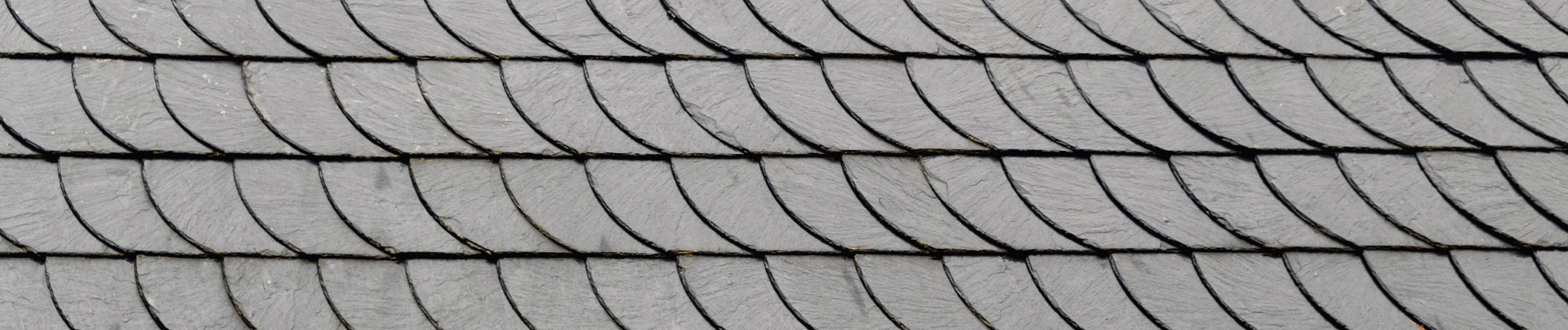 Natural slate roofing system on an architectural property