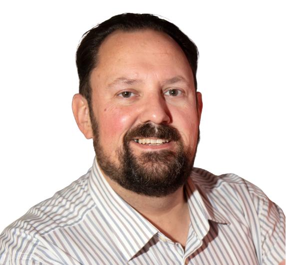 Smiling man with dark hair and beard wearing a striped collared shirt against a white background.