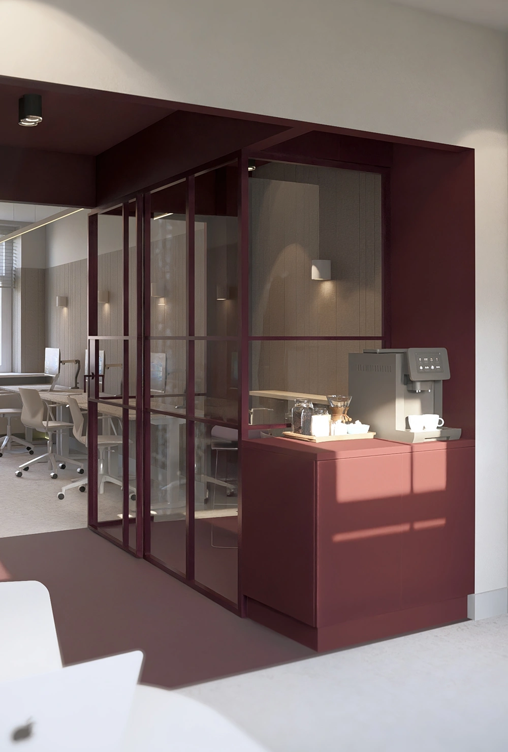 Modern office corner with burgundy glass walls and a coffee machine on a matching cabinet.