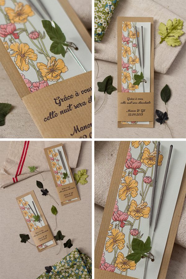 Baguettes d'étincelles personnalisées dans des étuis en kraft avec motifs floraux jaunes et roses.