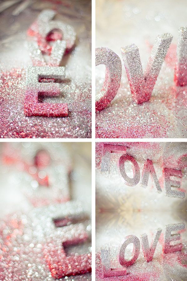 Lettres LOVE scintillantes et pailletées, dégradé de blanc et rose, ambiance romantique et lumineuse.
