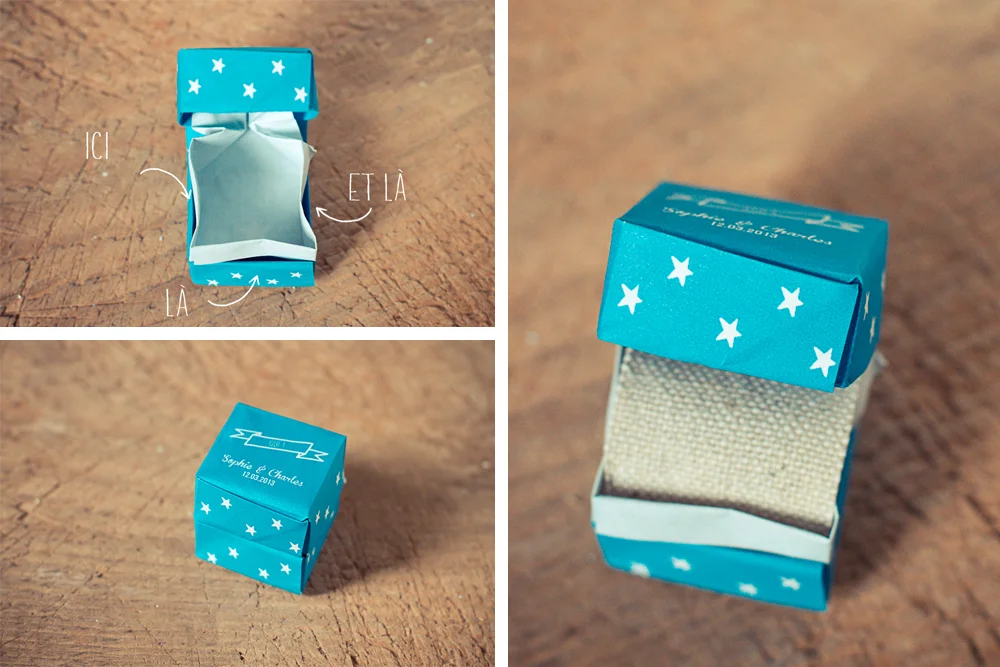 Petit écrin à alliances bleu turquoise étoilé, personnalisé et fait main, posé sur un fond en bois rustique.