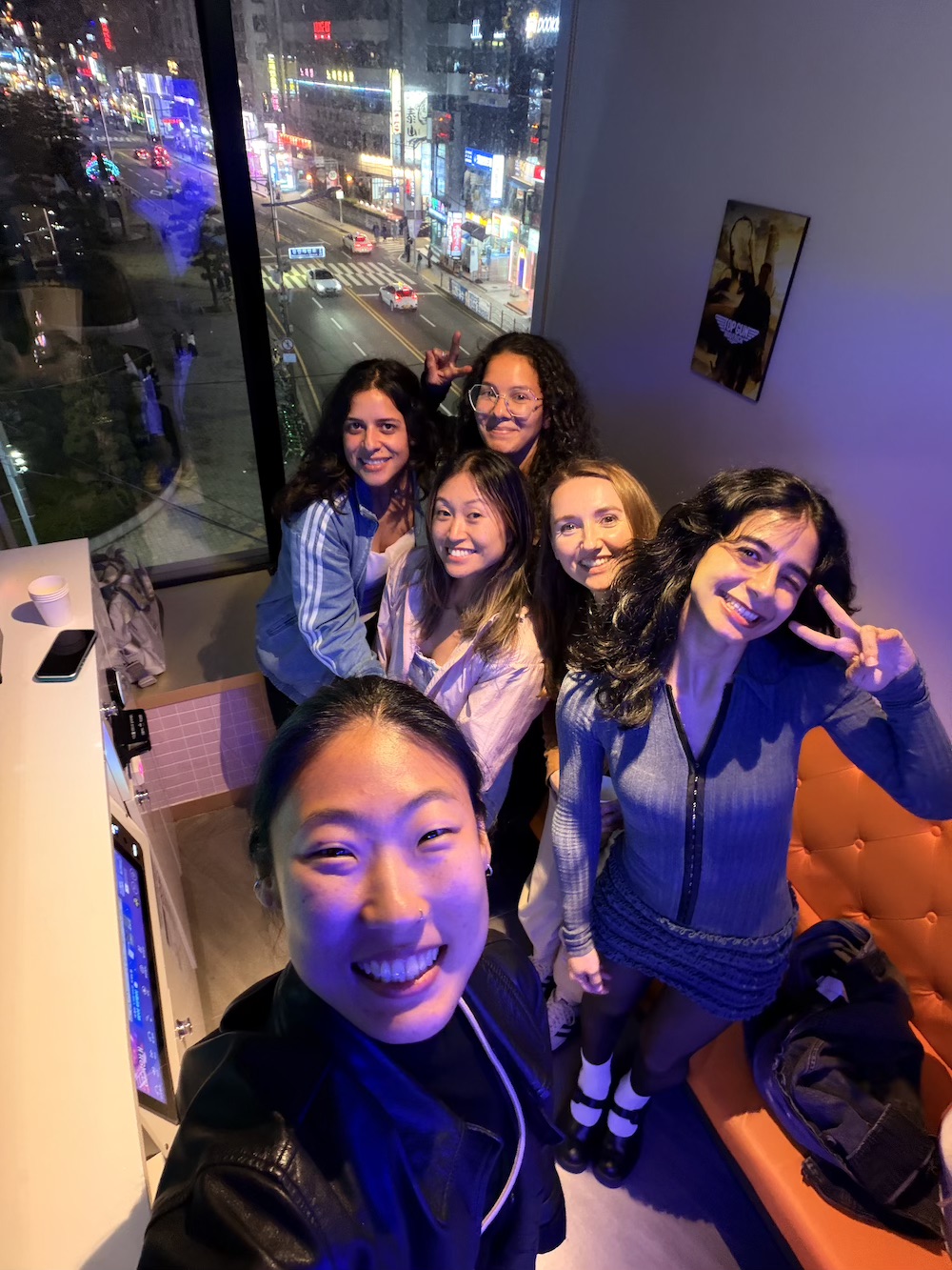 K-Pole participants posing in a Korean Karaoke venue.
