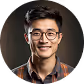Smiling young man with glasses and checkered shirt against blurred dark background.