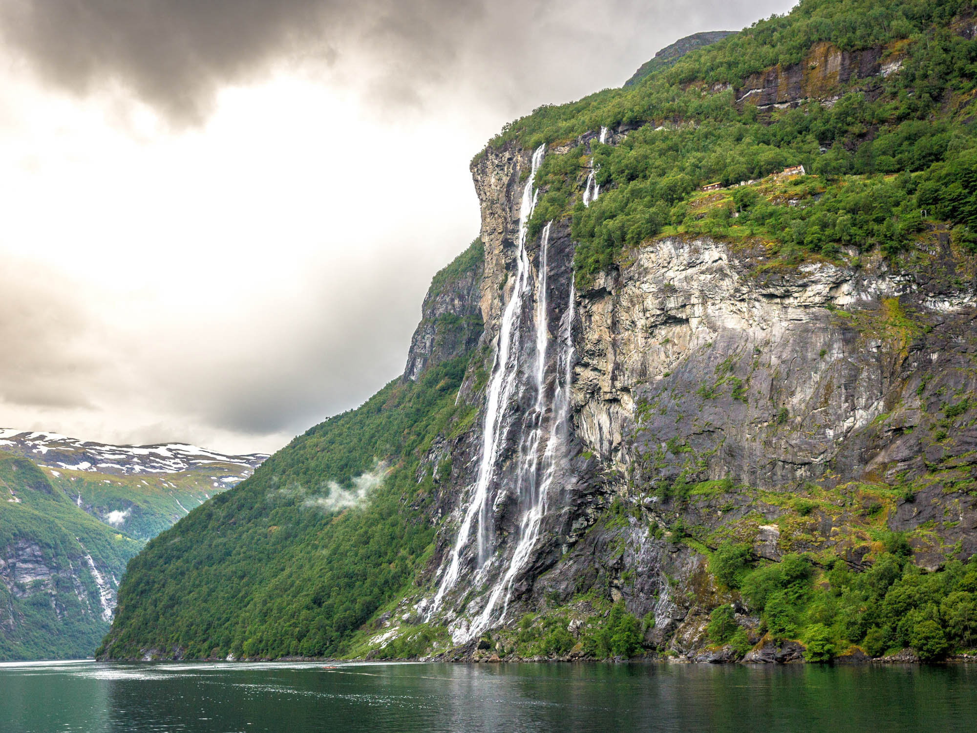 Dramatic Norwegian fjord landscape — raw Arctic wilderness at the water's edge