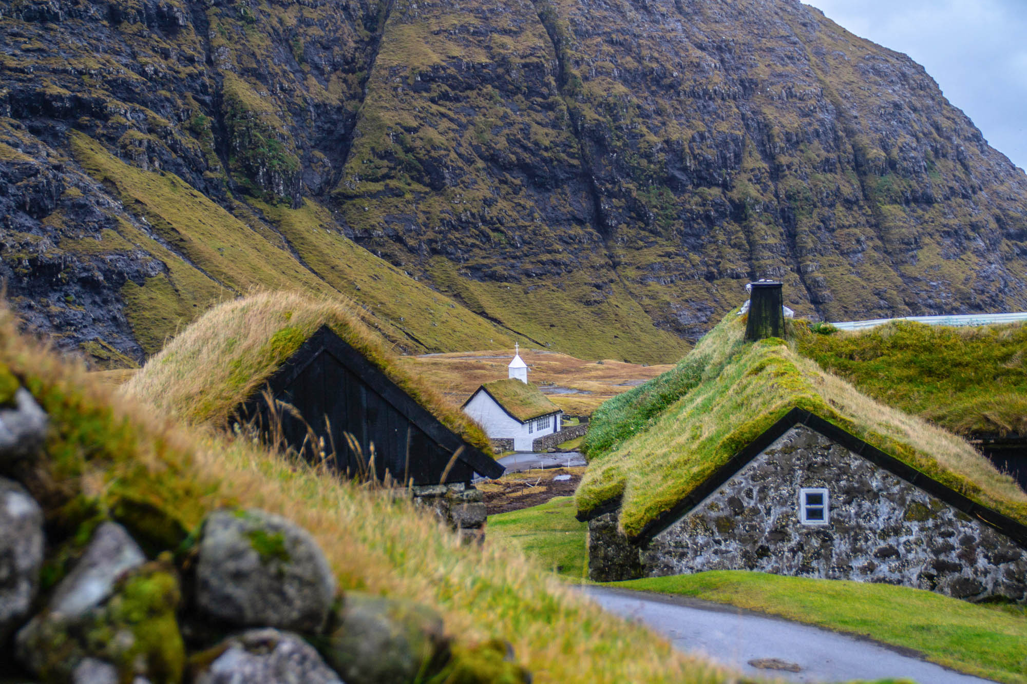Faroe Islands — steep green slopes meeting the North Atlantic