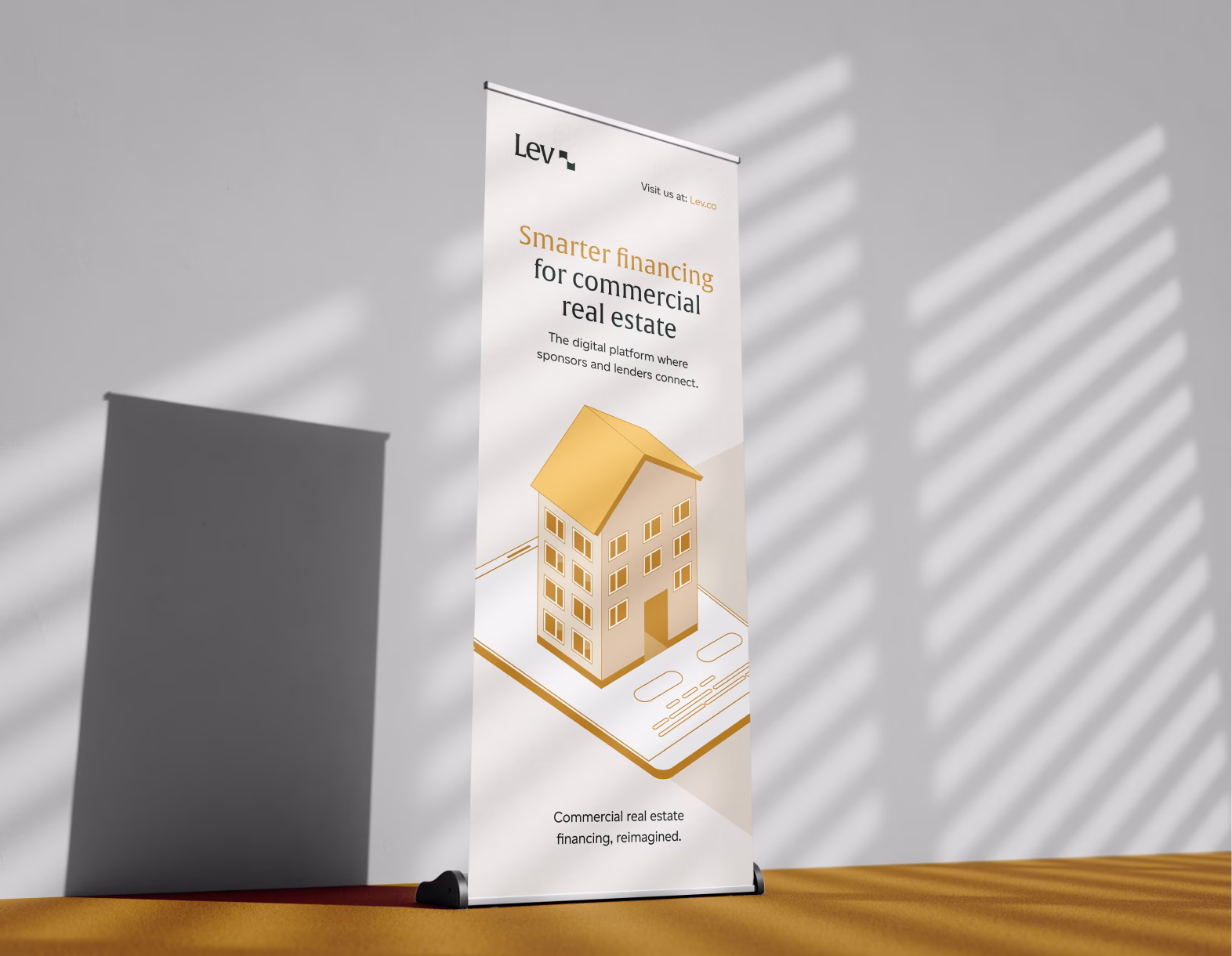 Lev pull-up banner with text about smarter financing for commercial real estate and a gold building graphic.