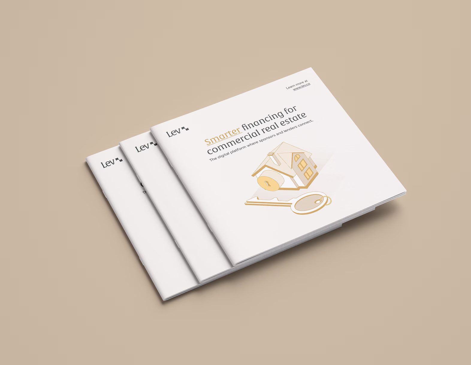 Stack of brochures titled Smarter financing for commercial real estate with a house and key illustration.