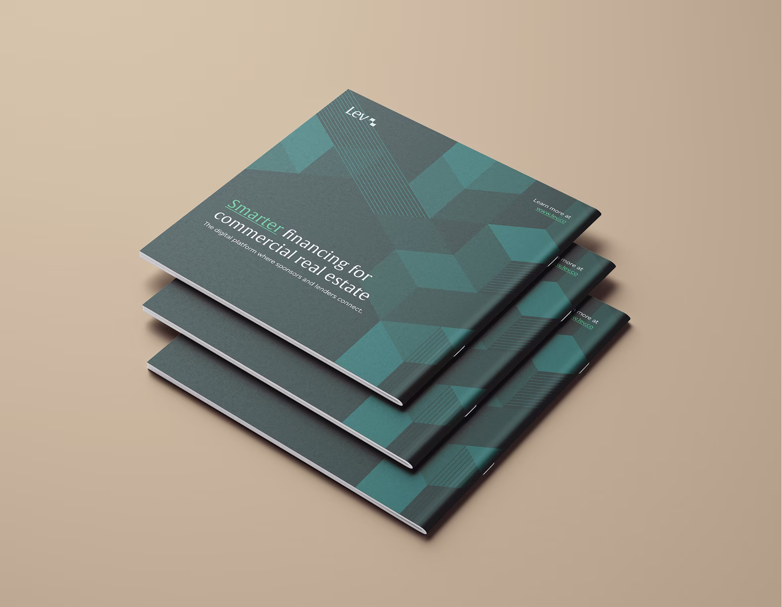 Stack of three greenish-blue brochures titled 'Smarter financing for commercial real estate' on beige background.