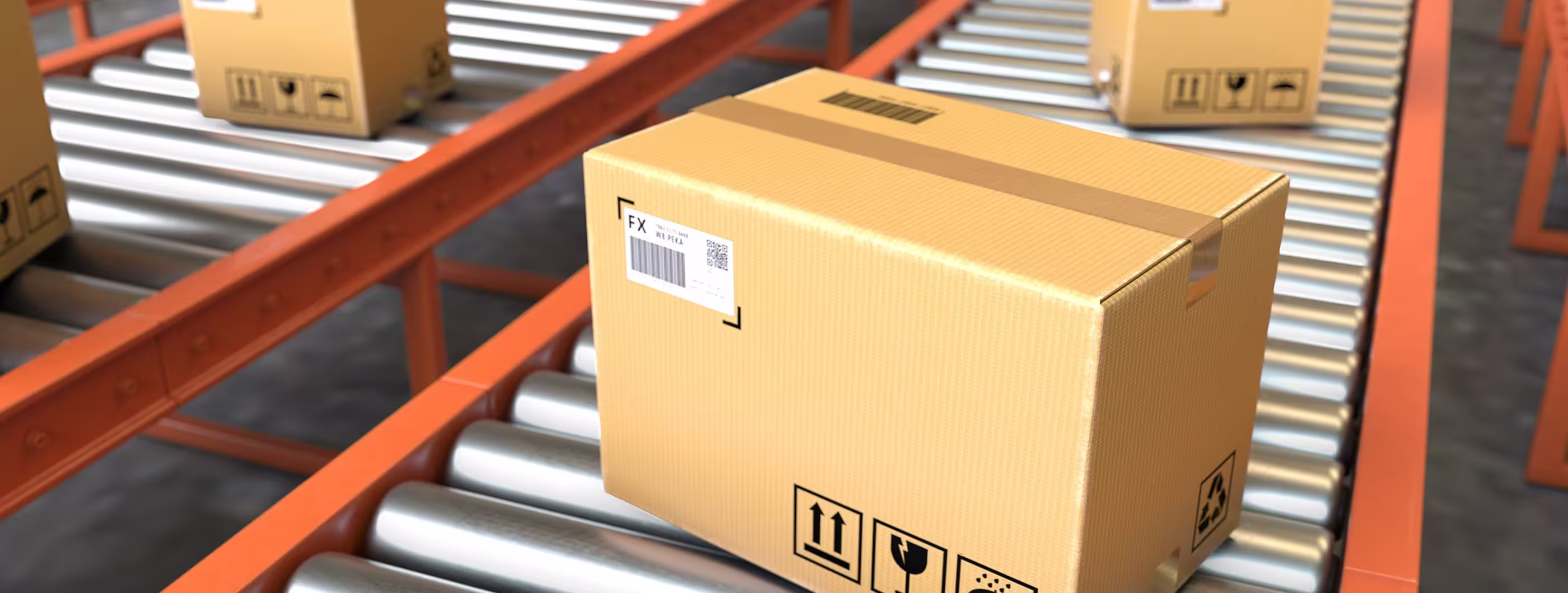 Cardboard shipping box with handling symbols moves along a metal roller conveyor in a warehouse, with other packages in the background.