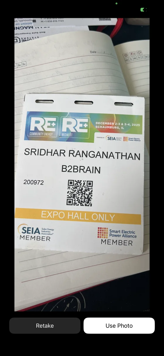 Reviewing the captured badge photo with retake and confirm options