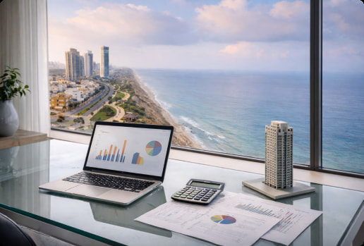 laptop on a table overseeing the sea