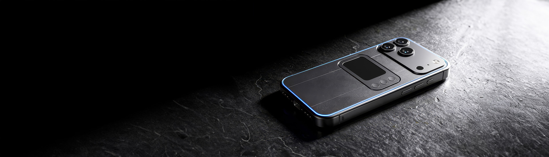 Comucase smartphone case flat rear view on a dark stone surface, showing the touchpad and camera module