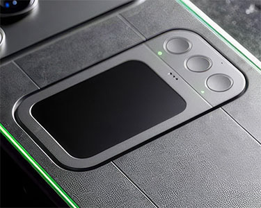 Close-up of Comucase's rear control module with green LED accent