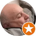 a bald man with a star on his forehead
