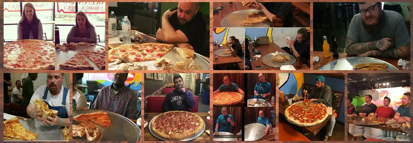 Various people eating and posing with large pizzas at a challenge event in a casual setting.