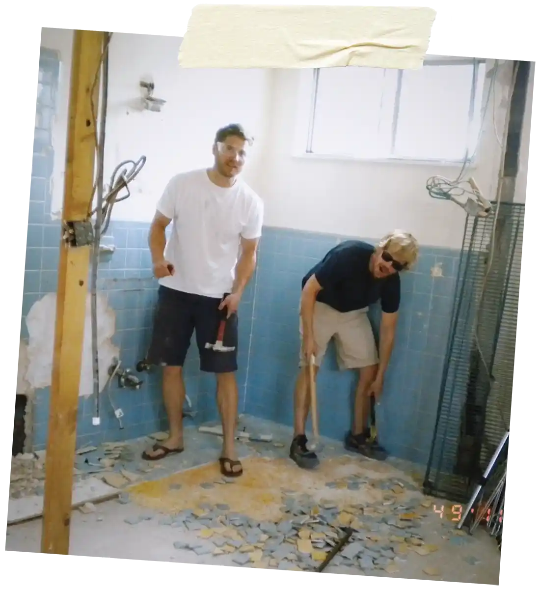 Two guys doing demo and construction for Benny's