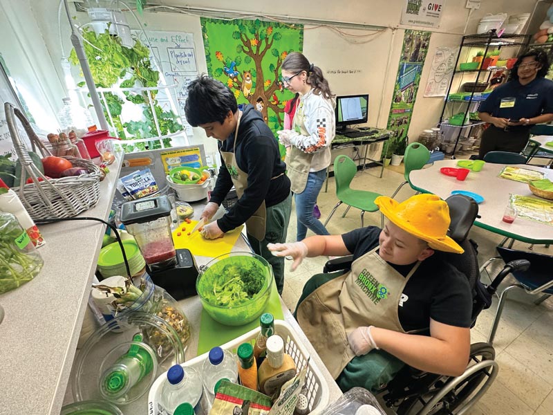 Students harvesting produce grown in class