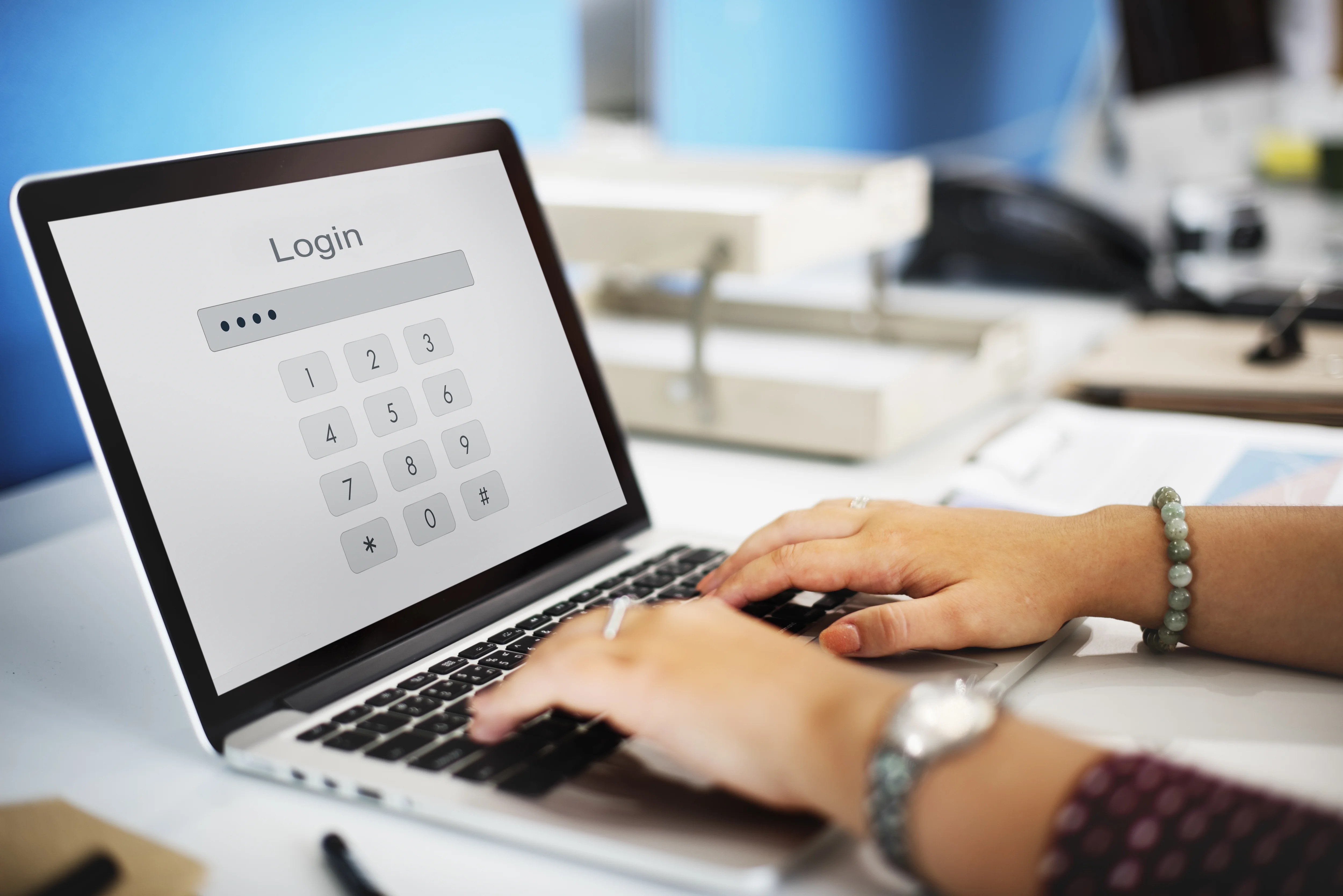 Secure login concept with a person entering a password on a laptop for identity verification and account access