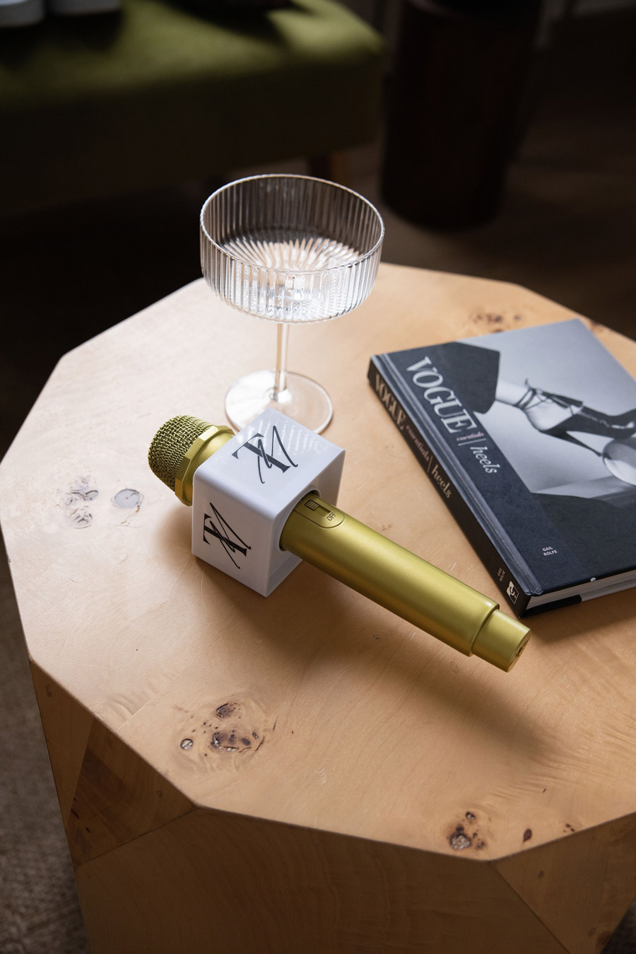 Branded microphone and book displayed on a wooden table for Tamiko McGurk's speaking brand.